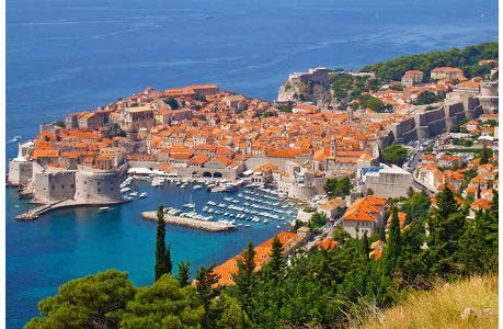 Dubrovnik with its harbour and the historic town wall